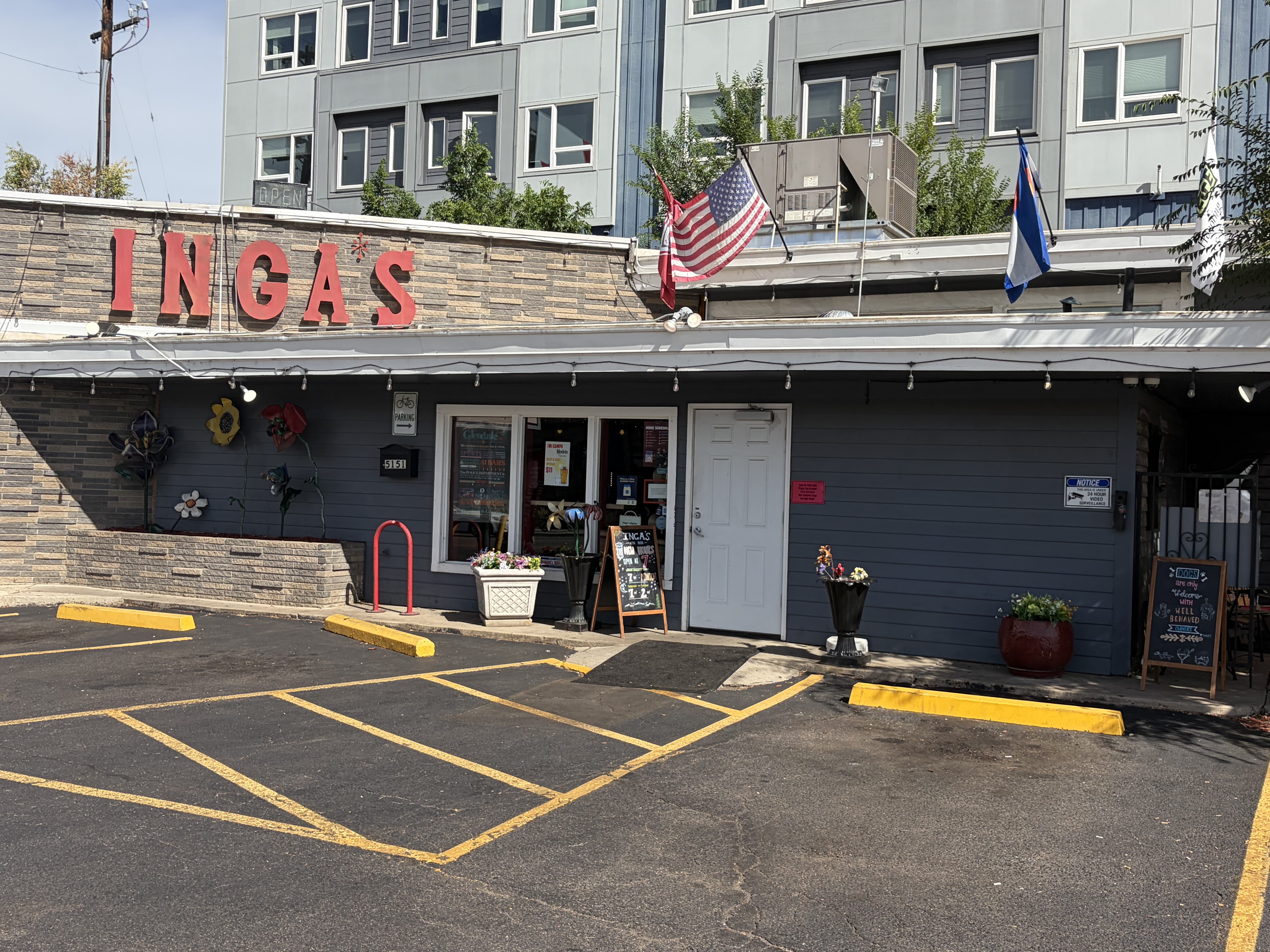 Inga's storefront on Leetsdale Drive, red letters, Colorado flag