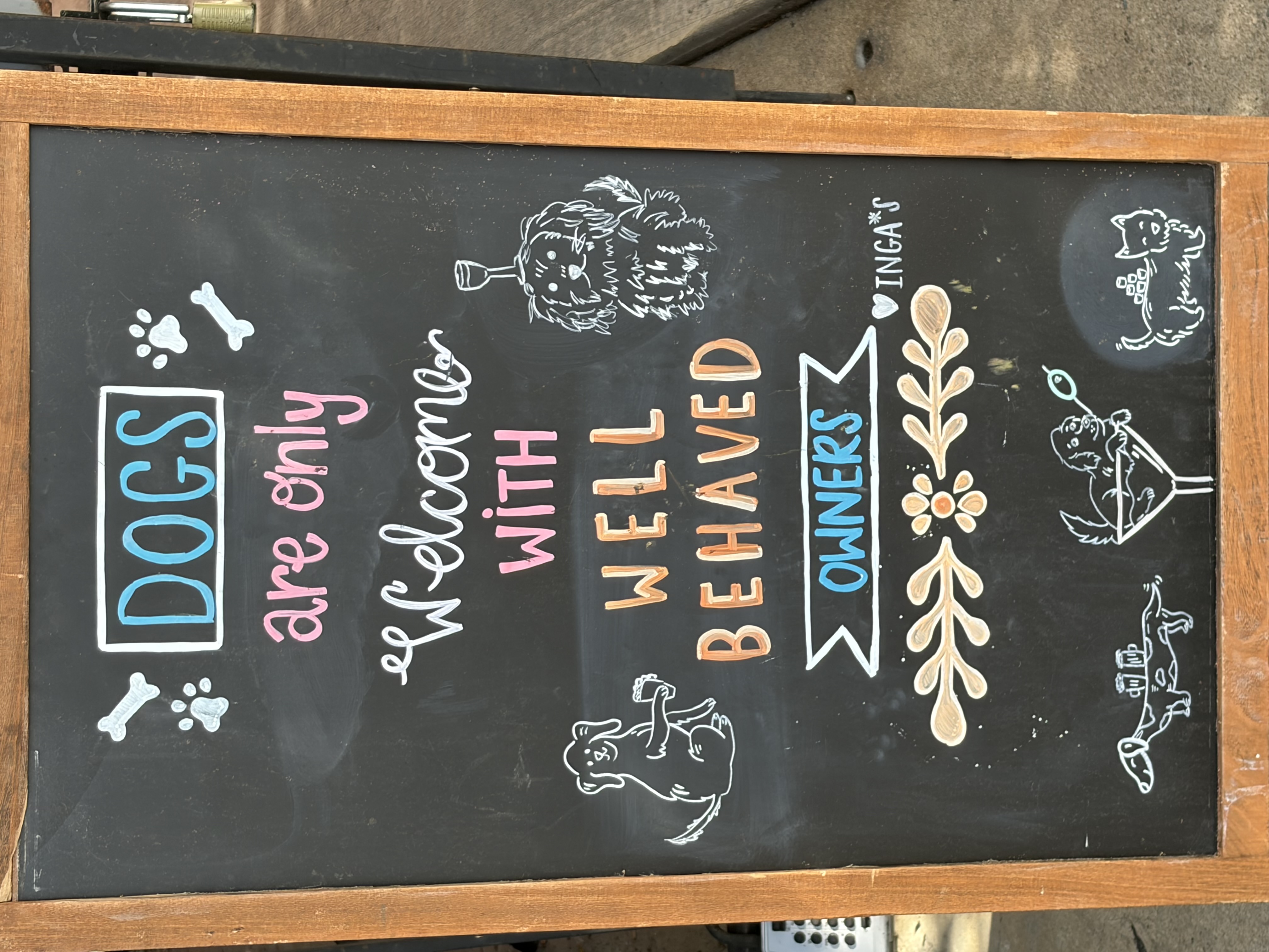 Chalkboard reading Dogs are only welcome with well behaved owners