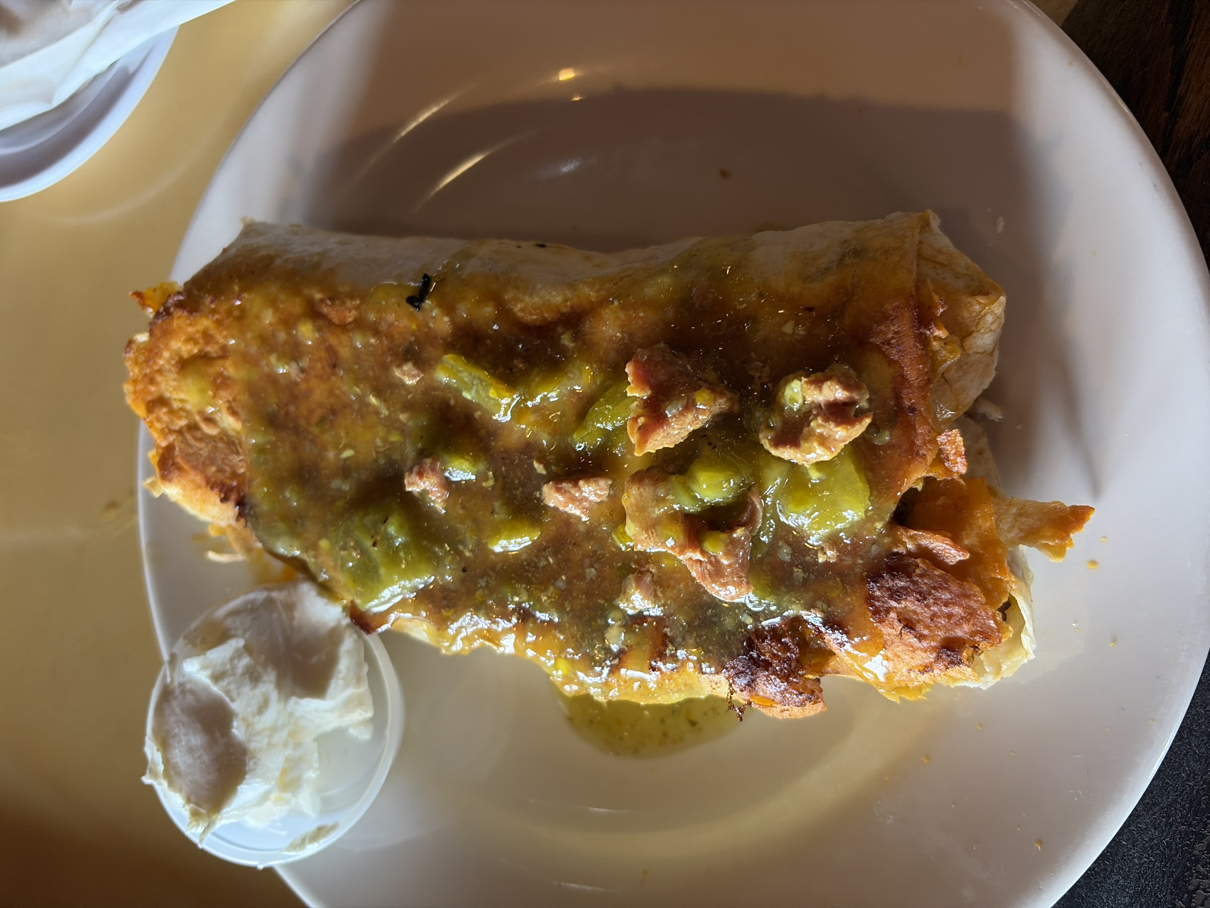 The OG breakfast burrito at Inga's Alpine Tavern, smothered in green chili